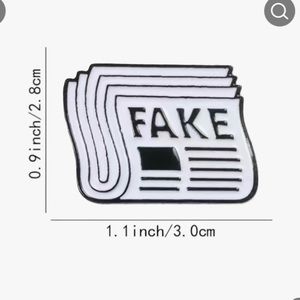 FAKE newspaper zinc aloy cartoon pin.